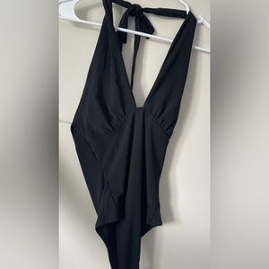 Black halter body suit.
